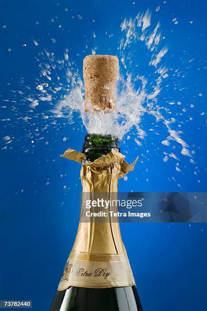close up of champagne cork popping - champagne cork stock pictures, royalty-free photos & images