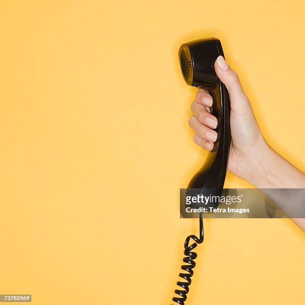Close Up Of A Woman Talking On A Landline Phone Photos and Premium High ...