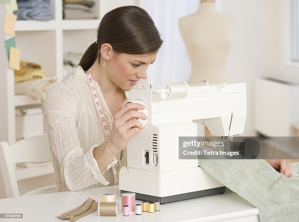Woman using sewing machine