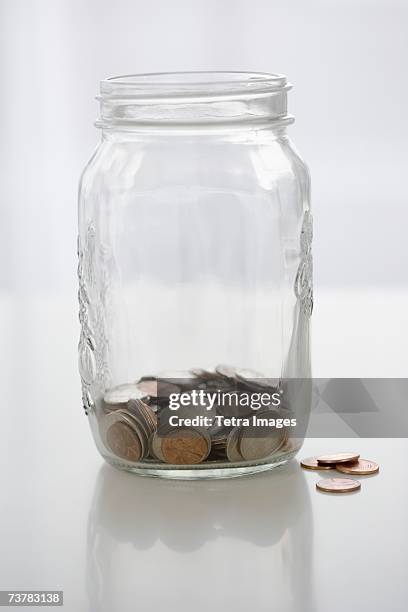 mason jar with change - mason jar stock pictures, royalty-free photos & images
