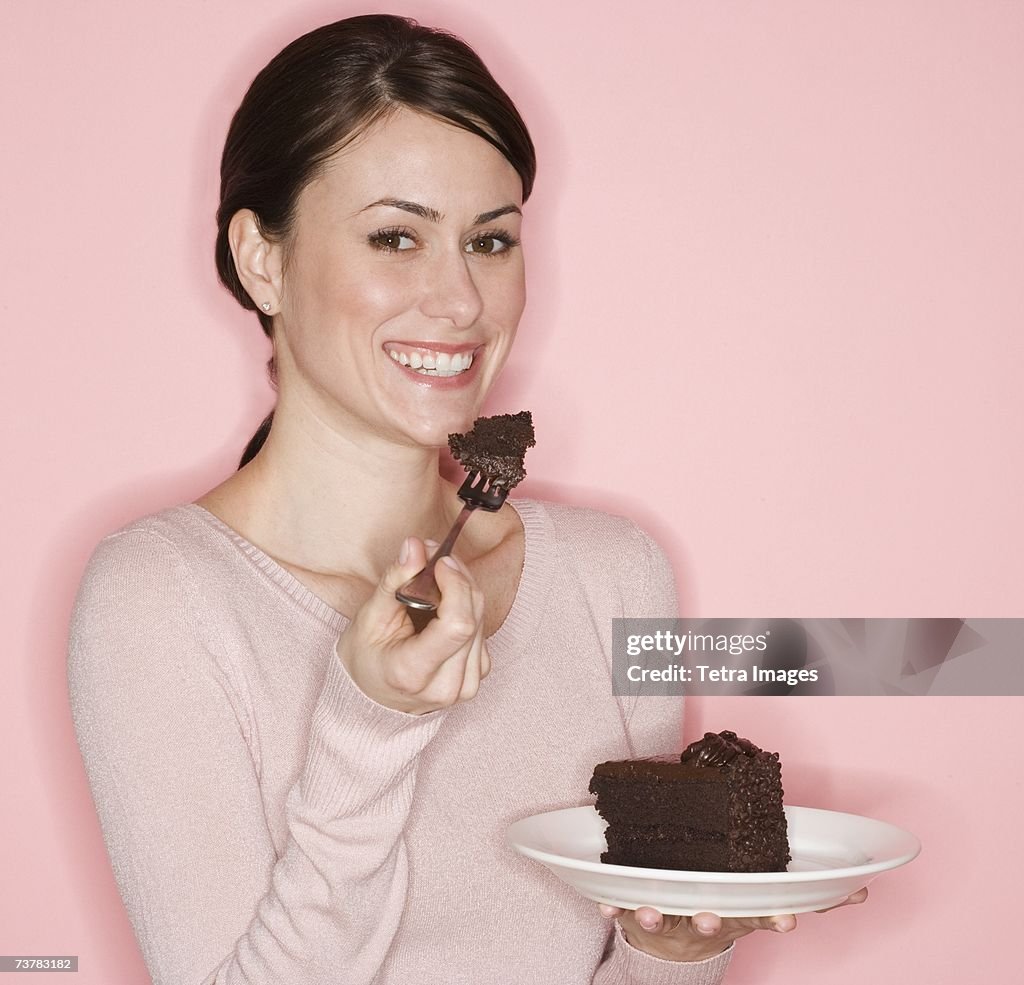 Portrait of woman eating cake