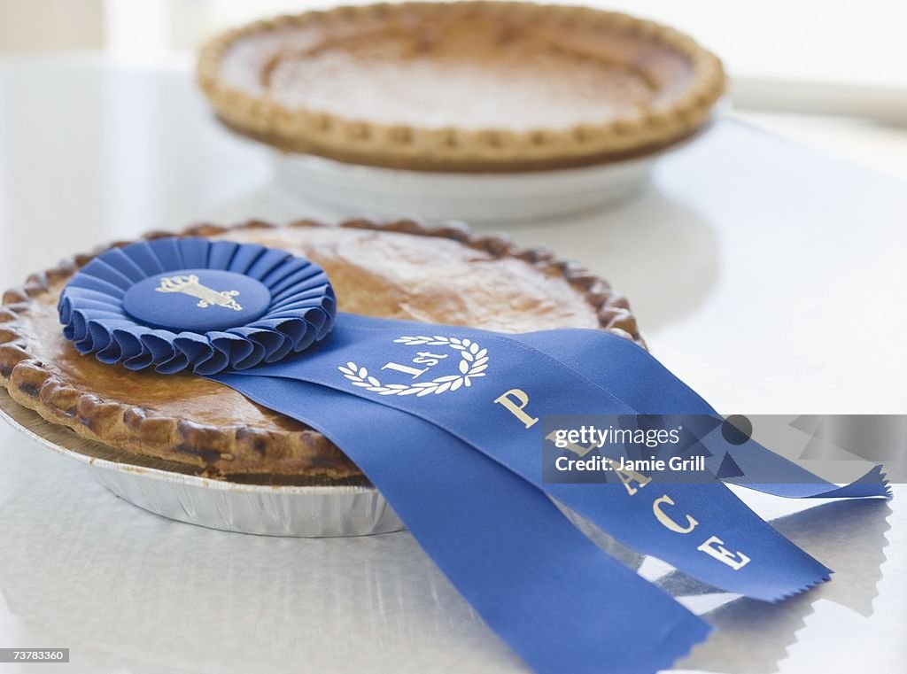 Close up of blue ribbon on pie