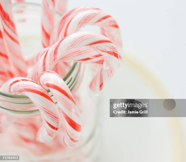 close up of candy canes in jar - candy jar stock pictures, royalty-free photos & images