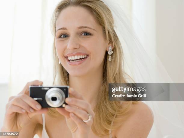 bride taking photograph - bride holding camera bildbanksfoton och bilder