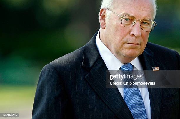Vice President Dick Cheney watches President George W. Bush at a news conference about the war appropriations bill in the Rose Garden of the White...