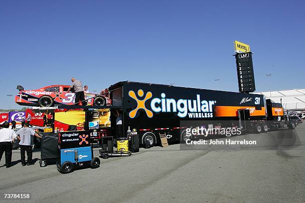 Crew members unload the Cingular Wireless Chevrolet, driven by Jeff Burton, during NASCAR Richmond Testing at Richmond International Raceway on April...