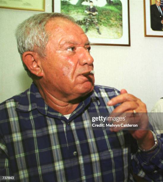 French fugitive businessman Alfred Sirven smokes a cigar while in custody February 2, 2001 in Manila, Philippines after being arrested hours earlier...