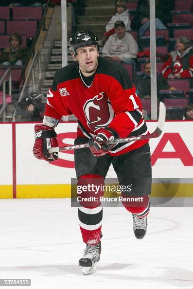 Michael Rupp of the New Jersey Devils skates for the puck during the ...
