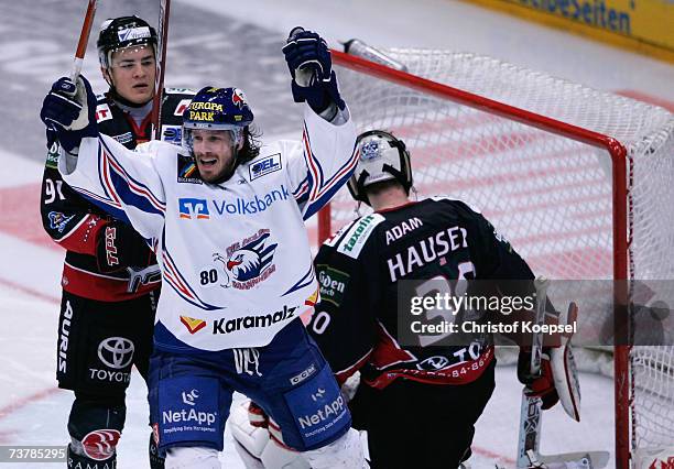 Martin Ancicka of the Adler celebrates the third goal during the DEL Play Off semi final match between Cologne Haie and Adler Mannheim at the...