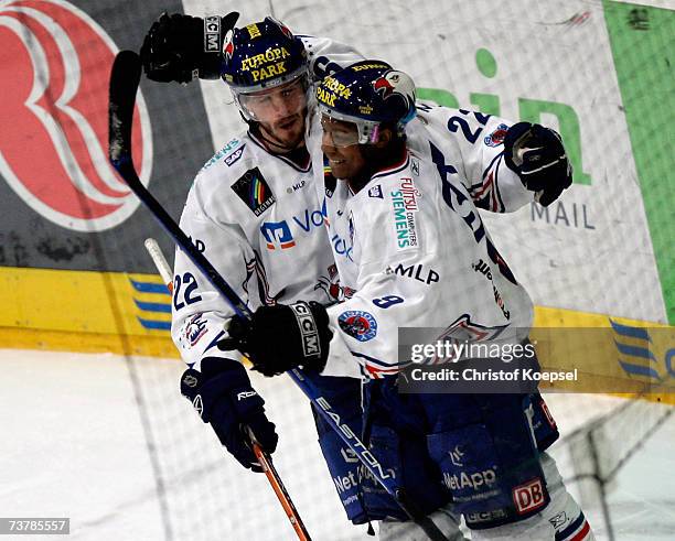 Colin Forbes of the Adler celebrates the fourth goal with Nathan Robinson during the DEL Play Off semi final match between Cologne Haie and Adler...