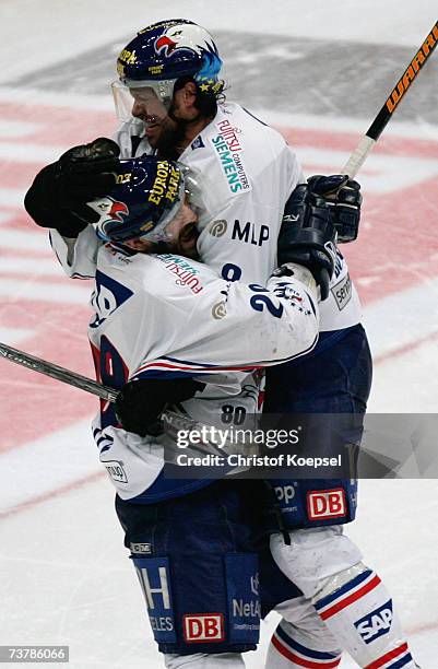 Jeff Shantz of the Adler celebrates the fifth goal with Francois Bouchard during the DEL Play Off semi final match between Cologne Haie and Adler...