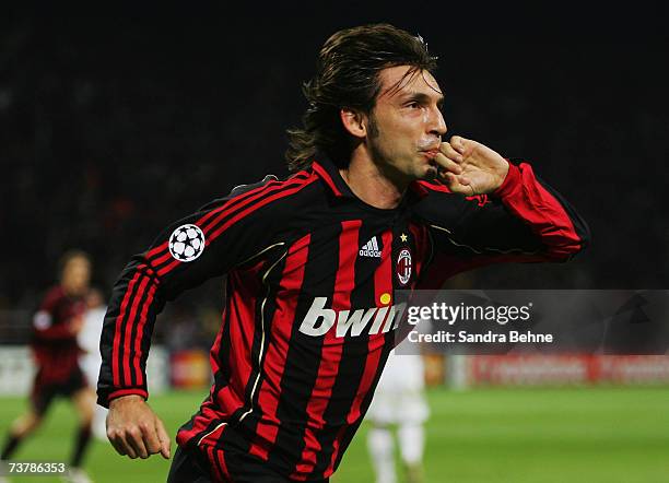 Andrea Pirlo of Milan celebrates after scoring the opening goal during the UEFA Champions League quarter final first leg match between AC Milan and...