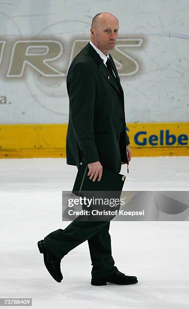 Head coach Doug Mason of the Haie walks off the ice after his team loses 4-6 in the DEL Play Off semi final match between Cologne Haie and Adler...