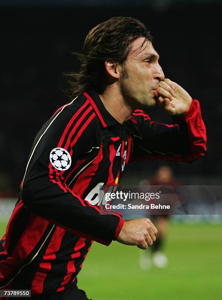 Andrea Pirlo of Milan celebrates after scoring the opening goal during the UEFA Champions League quarter final first leg match between AC Milan and...