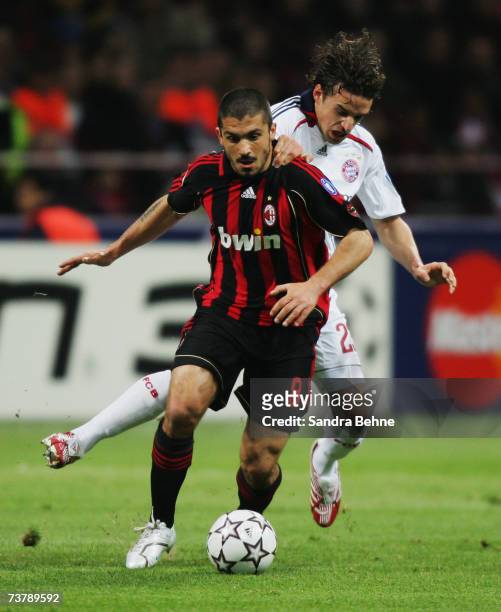Gennaro Gattuso of Milan challenges Owen Hargreaves of Bayern during the UEFA Champions League quarter final first leg match between AC Milan and...