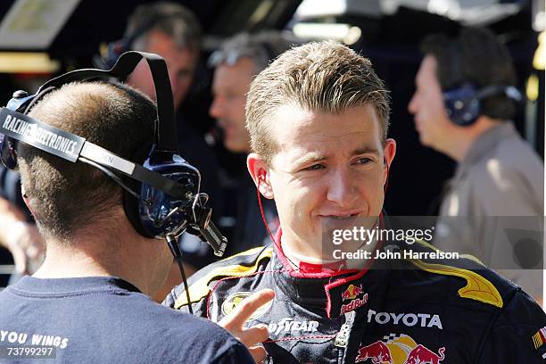 Allmendinger driver of the Red Bull Toyota talks with a crew member during NASCAR Richmond Testing at Richmond International Raceway on April 3, 2007...