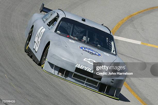 Jimmie Johnson driver of the Lowe's Chevrolet heads into turn four during NASCAR Richmond Testing at Richmond International Raceway on April 3, 2007...