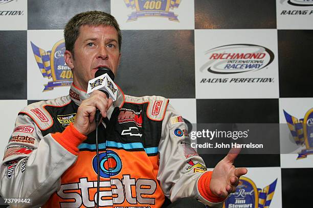 Ward Burton driver of the State Water Heaters Chevrolet talks to the media during NASCAR Richmond Testing at Richmond International Raceway on April...