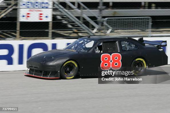 Snickers Dark Car Ricky Rudd Ricky Rudd driver of the Snickers Ford heads down the back streatch ...