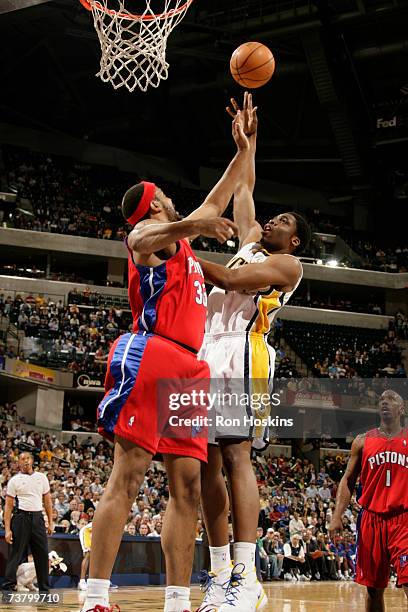 Ike Diogu of the Indiana Pacers shoots over Rasheed Wallace of the Detroit Pistons at Conseco Fieldhouse April 3, 2007 in Indianapolis, Indiana. NOTE...