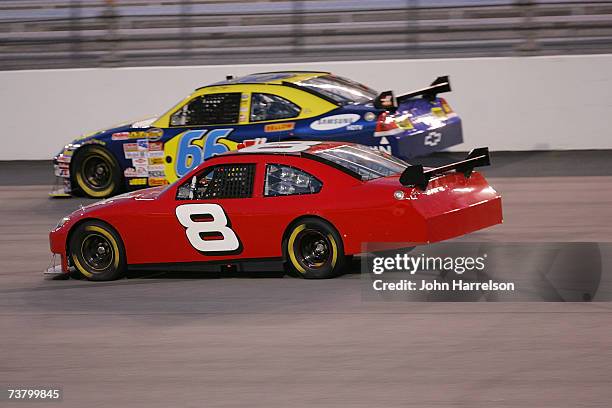 Jeff Green Best Buy Chevrolet races with Dale Earnhardt Jr. #8 Budweiser Chevrolet during NASCAR Richmond Testing at Richmond International Raceway...