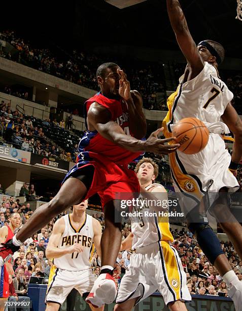 Chris Webber of the Detroit Pistons passes the ball around Jermaine O'Neal of the Indiana Pacers at Conseco Fieldhouse April 3, 2007 in Indianapolis,...