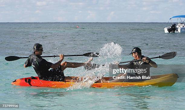 Glenn McGrath and Brad Hogg of Australia splash each other with water on their sea kayak trip in the sea outside the Occidental Grand Pineapple Beach...