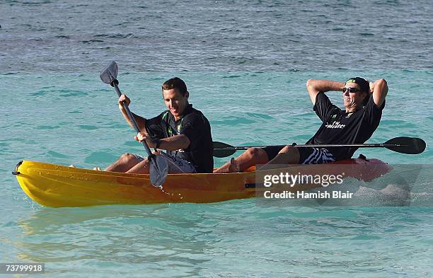 Glenn McGrath of Australia relaxes as team-mate Brad Hoggpaddles a sea kayak in the sea outside the Occidental Grand Pineapple Beach Resort on April...