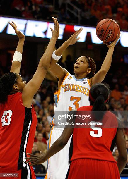 Candace Parker of the Tennessee Lady Volunteers attempts a shot against Rashidat Junaid and Essence Carson of the Rutgers Scarlet Knights during the...