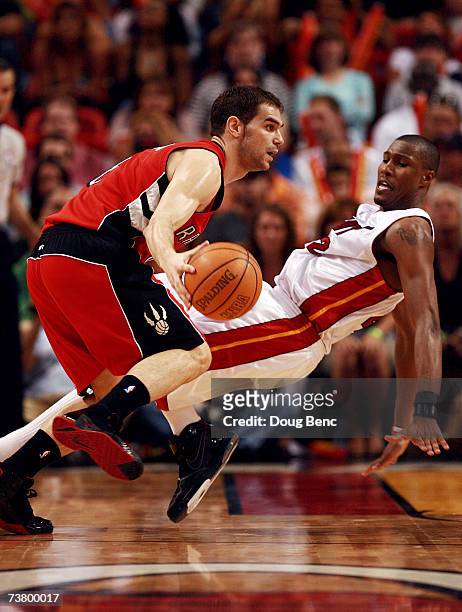 James Posey of the Miami Heat tries to draw a charge from Jose Calderon of the Toronto Raptors at American Airlines Arena on April 3, 2007 in Miami,...