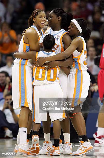 Candace Parker , Shannon Bobbitt, Nicky Anosike and Alberta Auguste of the Tennessee Lady Volunteers react after Anosike scored a 2-point basket...