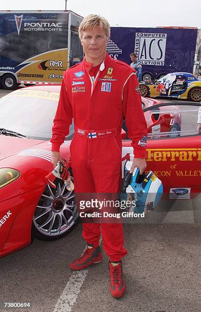 American Le Mans Series Ferrari driver Mika Salo with his car poses at the press day for the Toyota Pro/Celebrity Race, part of the 33rd Annual...