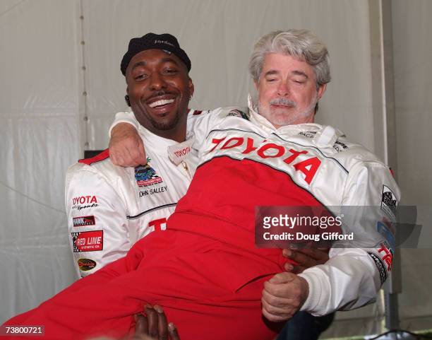 Former NBA player John Salley and film maker George Lucas in high spirits at the press day for the Toyota Pro/Celebrity Race, part of the 33rd Annual...