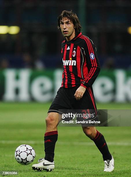 Andrea Pirlo of Milan runs with the ball during the UEFA Champions League quarter final first leg match between AC Milan and Bayern Munich at the...