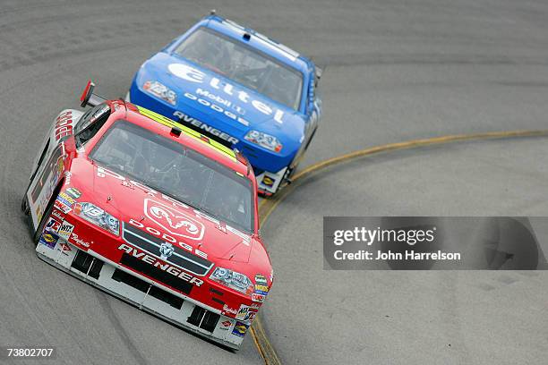 Elliott Sadler driving the Dodge Dealers/UAW Dodge leads Ryan Newman Alltel Dodge on Turn 2 during NASCAR Richmond Testing at Richmond International...