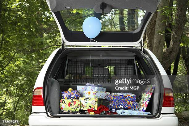 car boot with present inside - empty car boot stock pictures, royalty-free photos & images