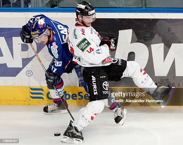 Christoph Ullmann of Mannheim competes with Daniel Rudslaett of Cologne during the DEL Bundesliga play off semi final game between Adler Mannheim and...