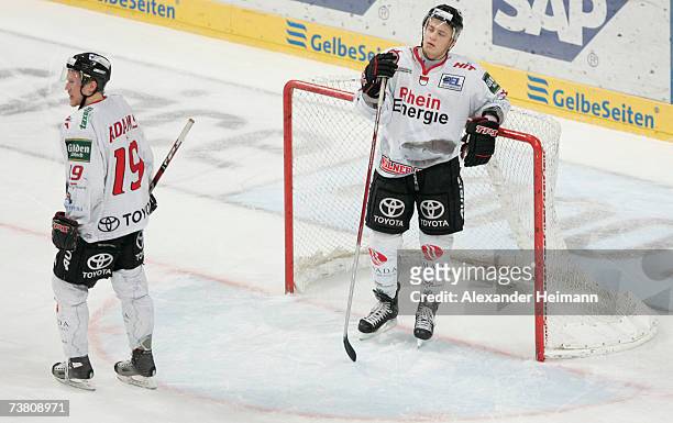 Players of Cologne look dejected after their defeat during the DEL Bundesliga play off semi final game between Adler Mannheim and Cologne Haie at the...