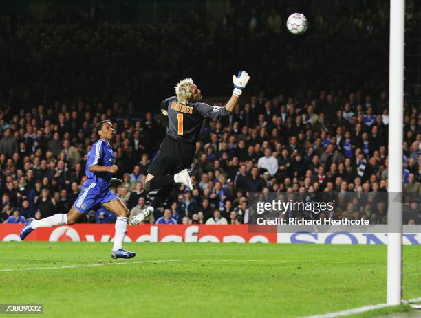 Didier Drogba of Chelsea chips the ball over Goalkeeper Santiago Canizares of Valencia, to score his teams second goal during the UEFA Champions...