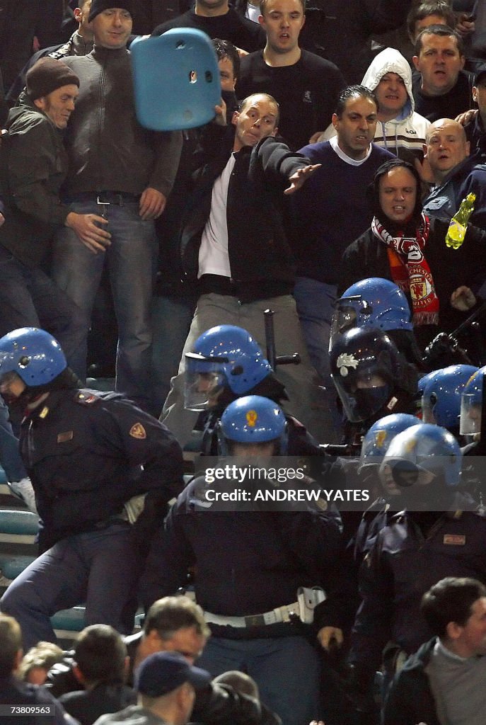 A Manchester United fan throws a seat du...