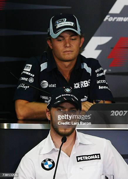 Nico Rosberg of Germany and Williams and Nick Heidfeld of Germany and BMW Sauber attend the press conference during previews to the Malaysian Formula...