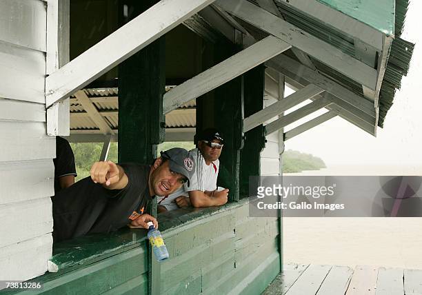 Justin Kemp and Jacques Kallis waiting for the rain to stop on Flag Island during the South Africa Cricket team's open-boat river trip up the...