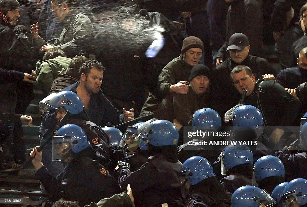 Manchester United fans face riot police...