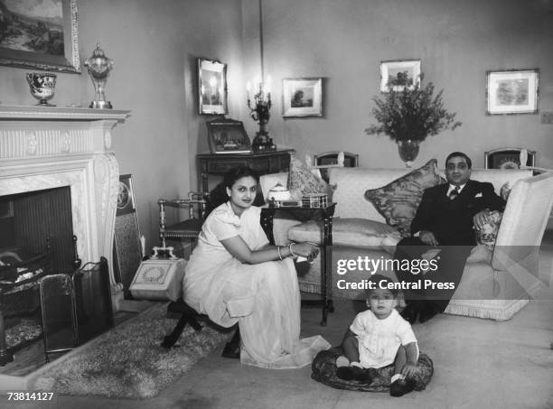 Sir Pratap Sinha, Maharaja Gaekwad of Baroda at home with his wife the Maharanee and their son Prince Sayajirao in Epsom, Surrey, October 1946.