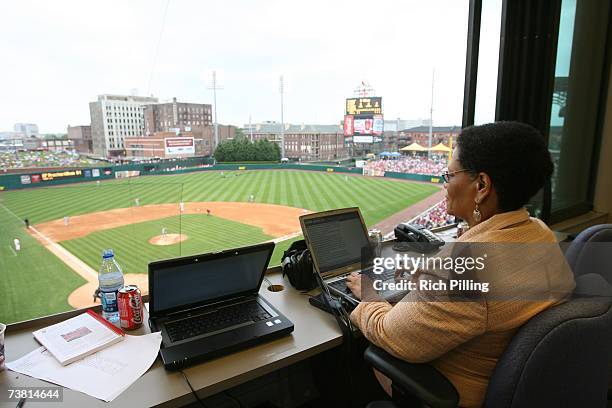 Claire Smith of the Philadelphia Inquirer writes in the press box during the Civil Rights Game between the St. Louis Cardinals and Cleveland Indians...