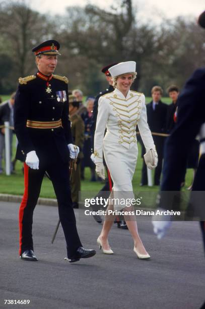 The Princess of Wales wears a suit by Catherine Walker and a hat by Graham Smith of Kangol during a visit to the Royal Military Academy Sandhurst in...