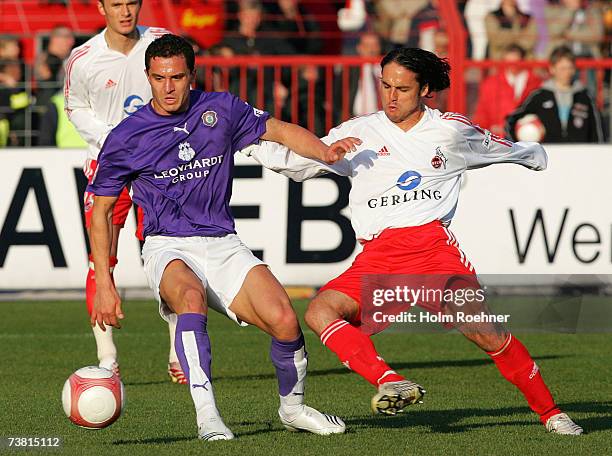 Dimitar Rangelov of Aue and Ricardo Cabanas of Koeln during the Second Bundesliga match between Erzgebirge Aue and 1.FC Cologne at the Erzgebirgs...