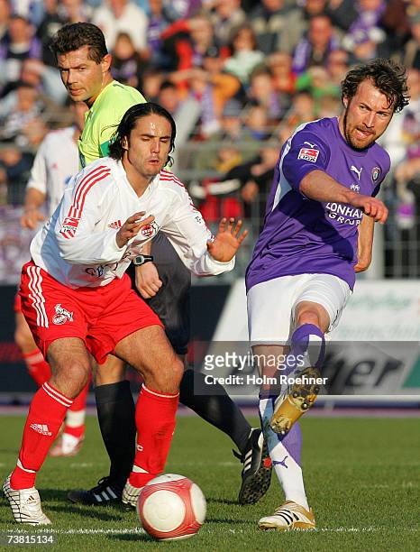 Marco Kurth of Aue and Ricardo Cabanas of Koeln during the Second Bundesliga match between Erzgebirge Aue and 1.FC Cologne at the Erzgebirgs stadium...