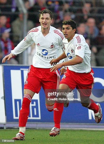 Milivoje Novakovic and Adil Chihi of Koeln celebrate a goal during the Second Bundesliga match between Erzgebirge Aue and 1.FC Cologne at the...