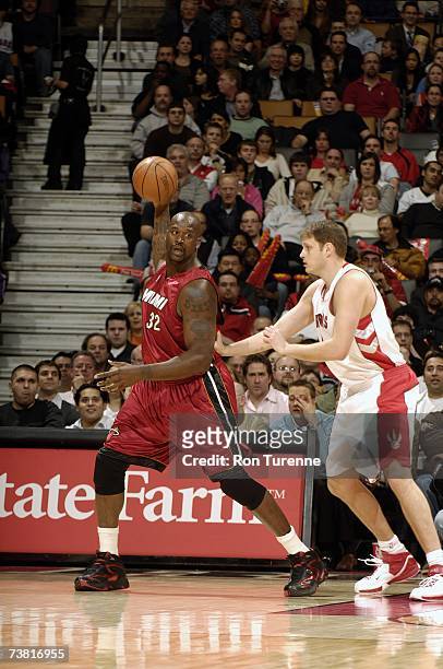 Shaquille O'Neal of the Miami Heat posts up against Rasho Nesterovic of the Toronto Raptors at Air Canada Centre on March 28, 2007 in Toronto,...